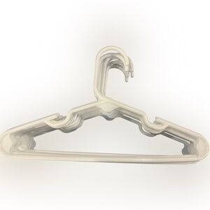 Lot of 65 children’s size plastic hangers. Variety